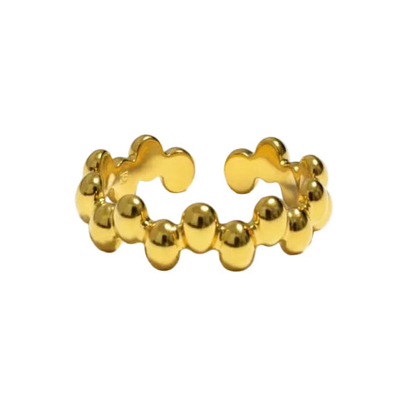 Gold ring with a beaded design on a white background