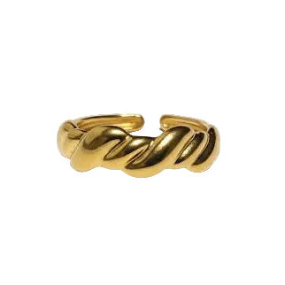 Gold ring with a twisted design on a white background